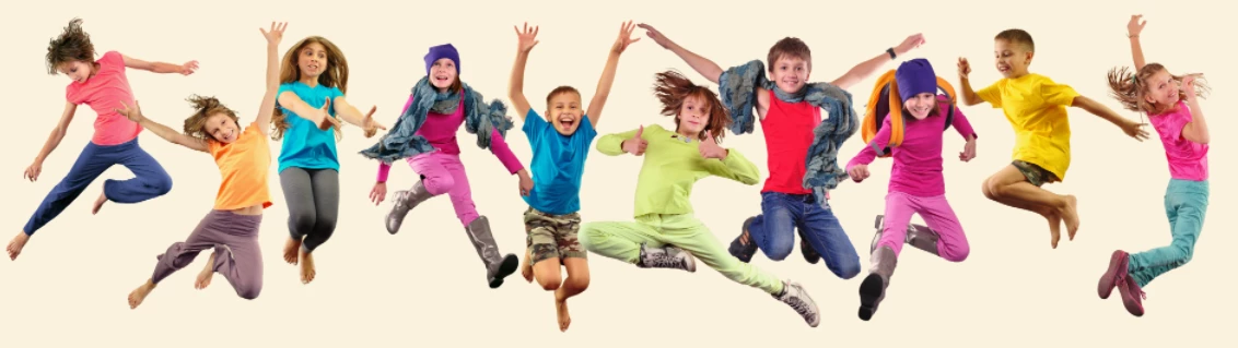 Happy kids jumping and smiling, full of energy and fun at a holiday camp